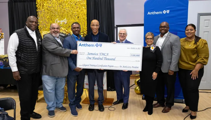 group photo holding anthem check