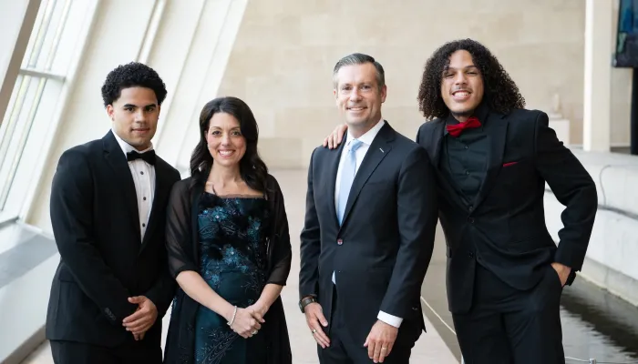 4 people stand inside met museum
