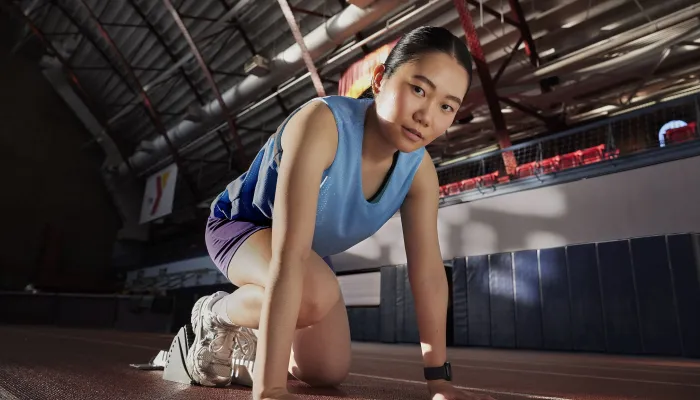 woman sprints on track
