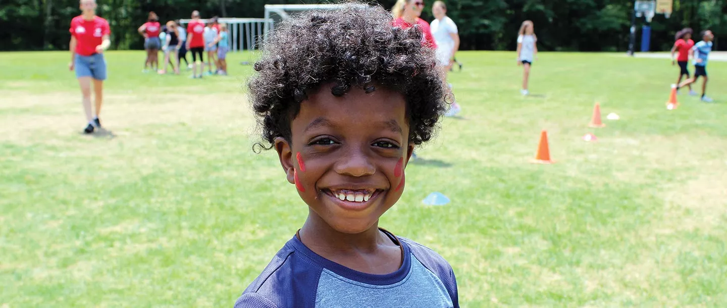 Boy with facepaint at summer camp