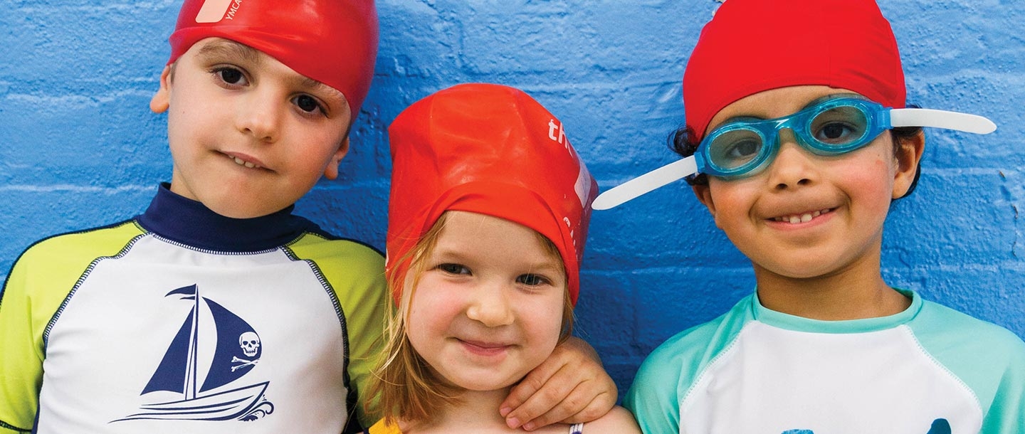 Three preschoolers ready for swim lesson