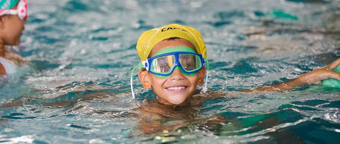 Boy swimming at Castle Hill YMCA indoor pool