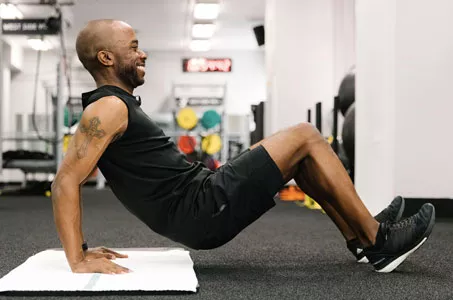 YMCA instructor demonstrates crab