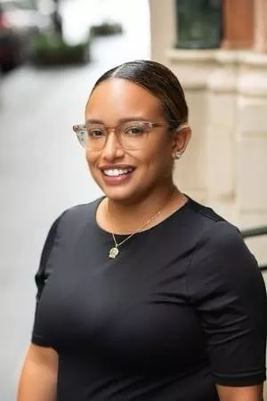 woman with black shirt on and glasses