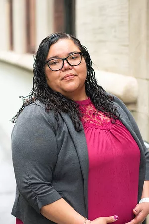 woman with gray cardigan and rose pink shirt