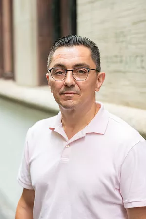 man with polo shirt and glasses
