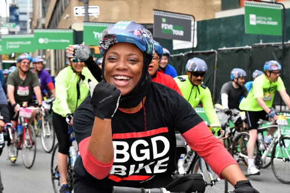 Cheerful woman riding bike in NYC