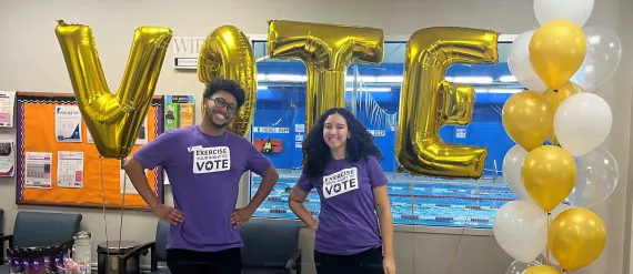 2 staff with vote balloons