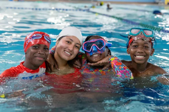 Lifeguard with campers at Cross Island Y.