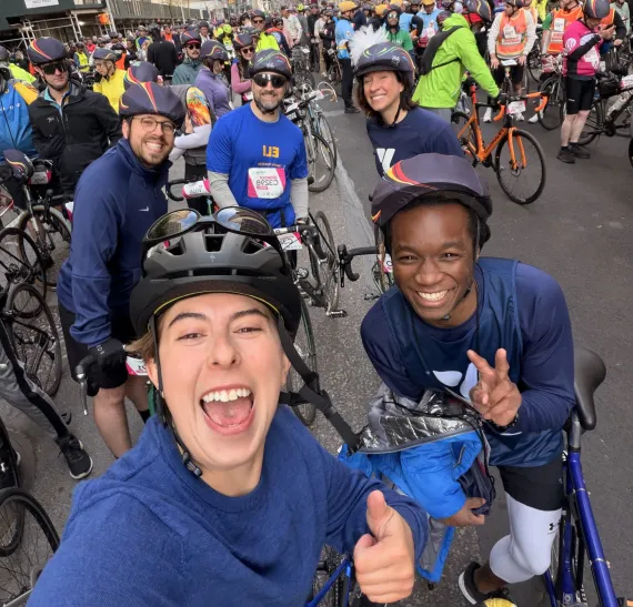 Team Y Champions cyclists pose at the 2026 TD 5 Boro Bike Tour start line.