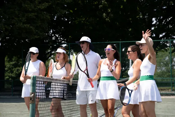 Honoree Maureen Bosetti with other tennis players, cheering on court