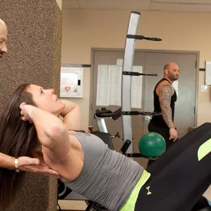 Personal trainer working with client at YMCA