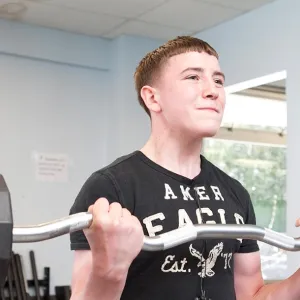Teen lifting weights at Staten Island Broadway YMCA