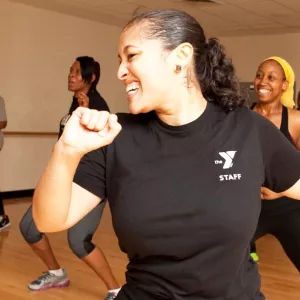 A group dances in a fitness class at the YMCA