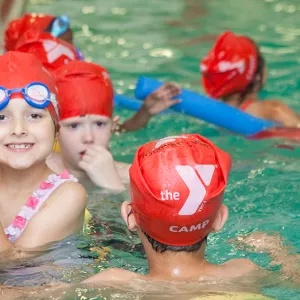 Camper swimming at the Greenpoint YMCA day camp