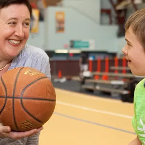 Mom and son at Park Slope Armory YMCA play basketball