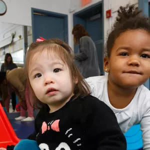 Two girls playing in Bed Stuy YMCA playroom for families