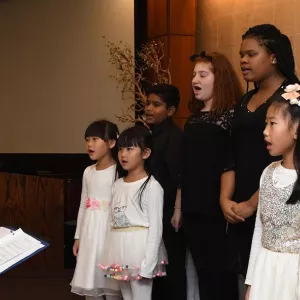 Children singing at Flushing YMCA event