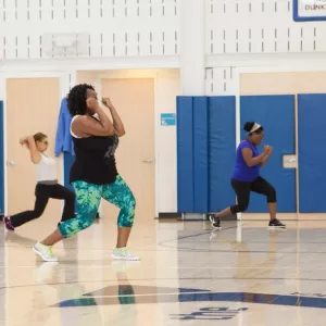 Group exercise instructor teaches YMCA fitness class