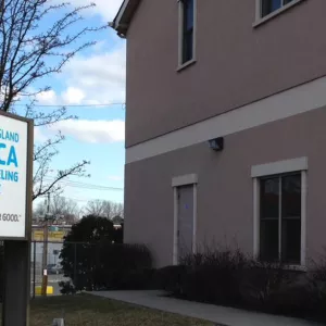 Exterior of a house with Y Counseling Service sign outside.
