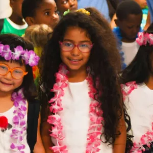 Kids dressed for a luau at the West Side YMCA summer camp.