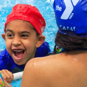 Camper learn to swim at YMCA indoor pool