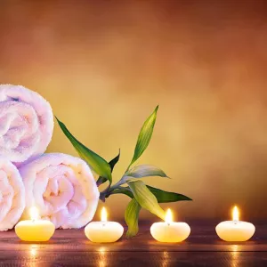 Flowers, towels and candles for massage therapy