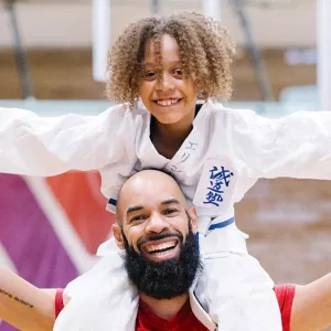 Dad and son in gymnasium