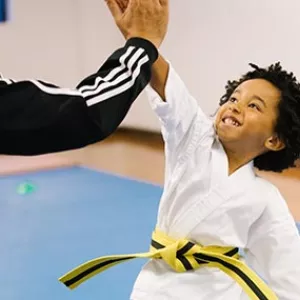 Karate kid gives coach high five