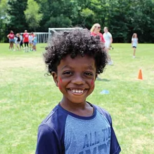 Boy with facepaint at summer camp
