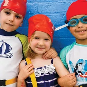 Three preschoolers ready for swim lesson