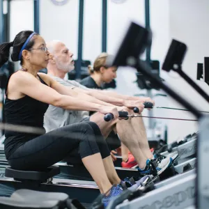 Fitness class using row machines