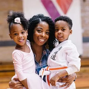Mom with ballerina and karate kid at West Side YMCA gym