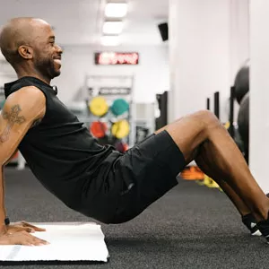 YMCA instructor demonstrates crab