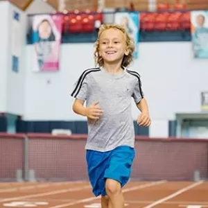 Boy running on the track