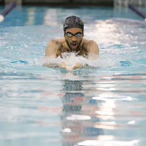 man in pool swimming