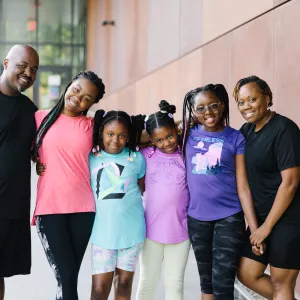 family standing outside the Y
