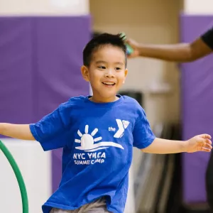 boy running in gym