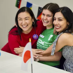 Three friends at a new immigrants event