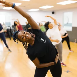 woman stretching in gym