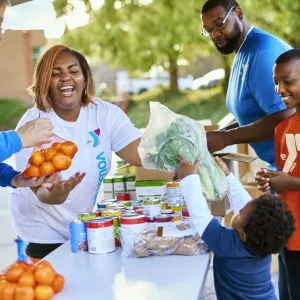 volunteer handing out fresh food