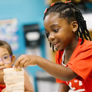 girl with jenga puzzle