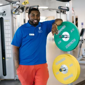 staff members with weights in gym