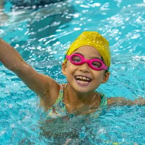 kid smiling in pool