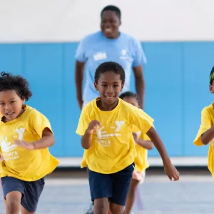 kids running in a gym