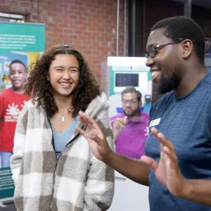 staff member talking to teen