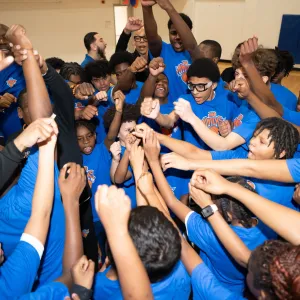 team raising hands