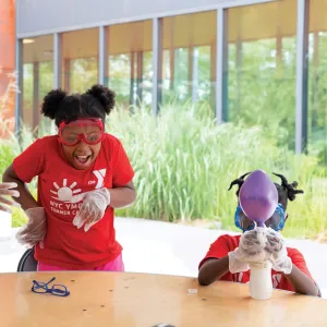 3 kids doing science projects