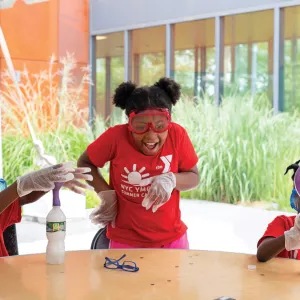 3 kids doing science projects