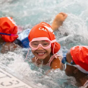 girl smiling in pool